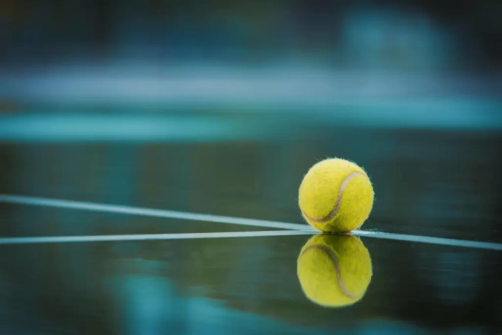 tennis ball on a hard court